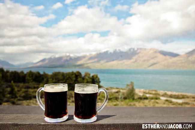 Enjoying the beer and the view at Lake Ohau Lodge New Zealand | 10 Day Guide to South Island New Zealand with Contiki.