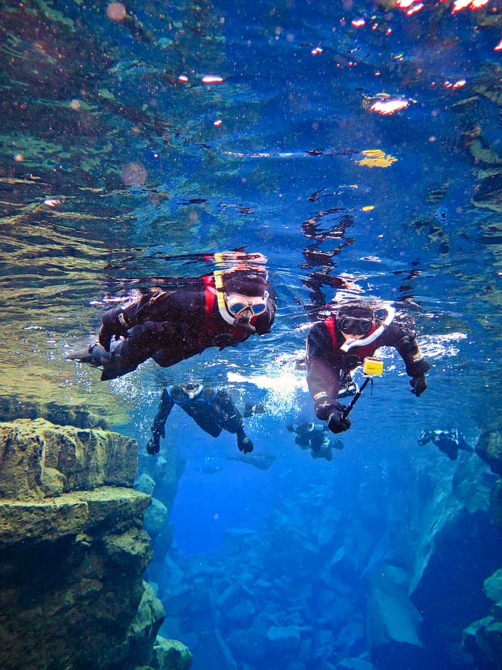 Silfra Snorkeling in Thingvellir National Park Iceland - Snorkel in the Silfra fissure between the North American and Eurasian continental plates. The underwater visibility is over 100 m and the water is pristine and drinkable during your dive or snorkel // localadventurer.com