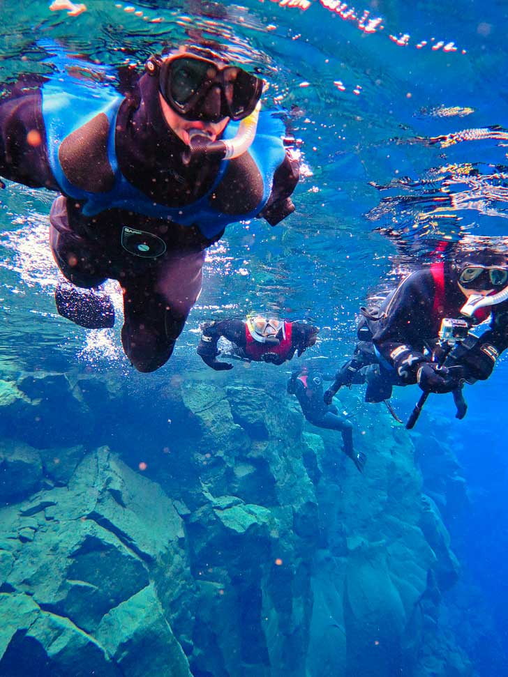 Silfra Snorkeling in Thingvellir National Park Iceland - Snorkel in the Silfra fissure between the North American and Eurasian continental plates. The underwater visibility is over 100 m and the water is pristine and drinkable during your dive or snorkel // localadventurer.com