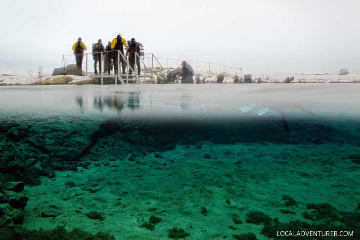 Snorkeling Silfra Fissure Þingvellir National Park Iceland - Snorkel between the continental plates of Eurasia and North America. The underwater visibility is over 100 m and the water is pristine and drinkable during your dive or snorkel // localadventurer.com