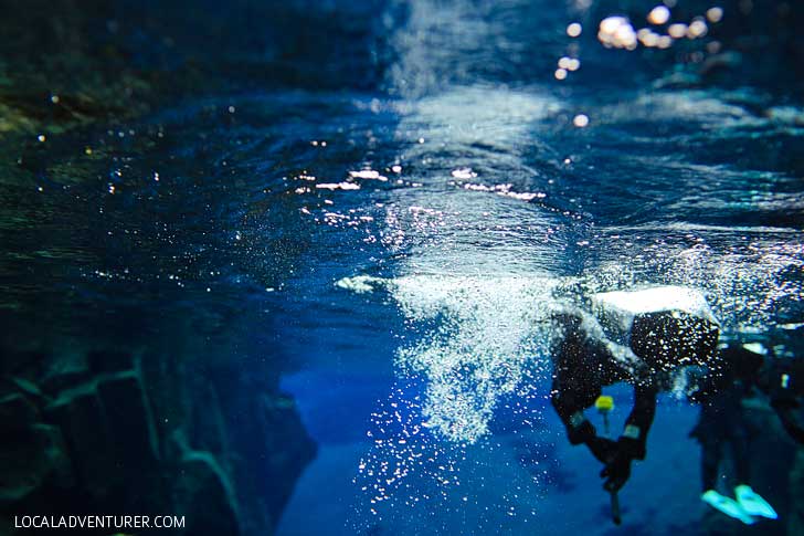 Snorkeling Silfra Fissure Þingvellir National Park Iceland - Snorkel between the continental plates of Eurasia and North America. The underwater visibility is over 100 m and the water is pristine and drinkable during your dive or snorkel // localadventurer.com