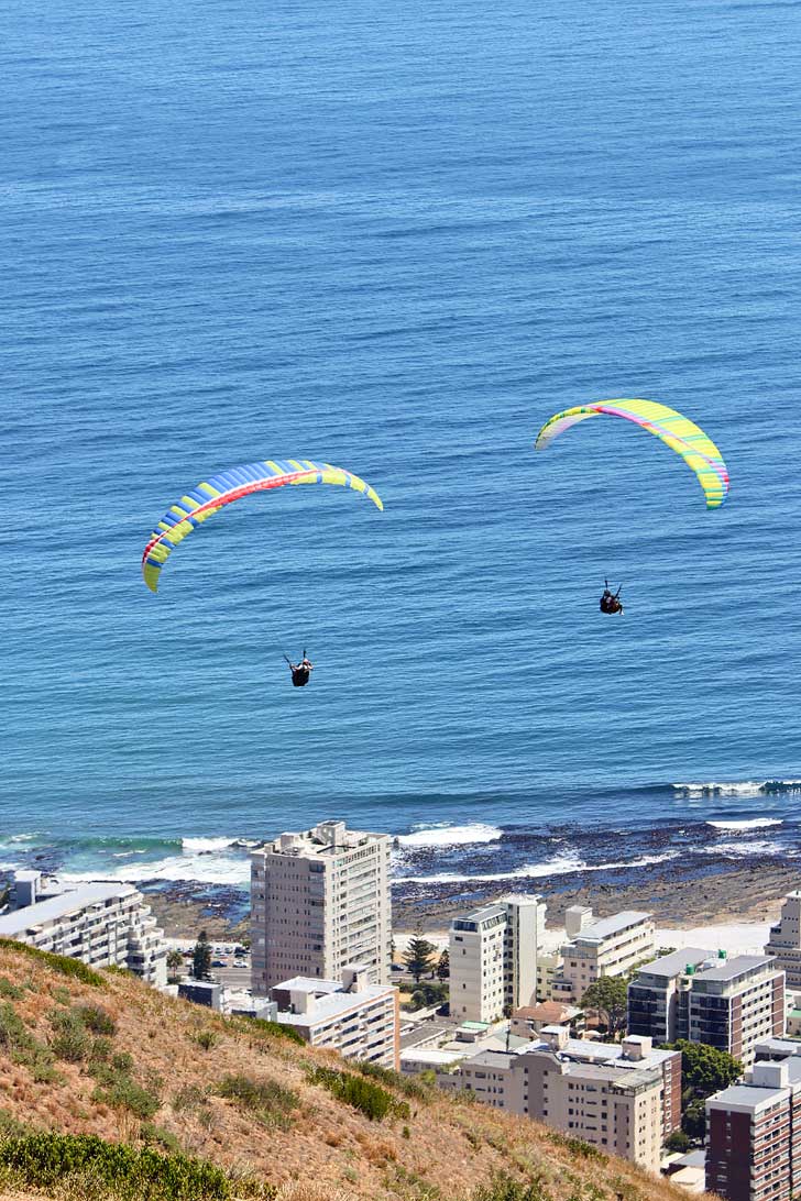 Cape Town Paragliding - one of the best things to do in Cape Town. You get a beautiful view Signal Hill, Lions Head, Table Mountain, and the ocean // localadventurer.com