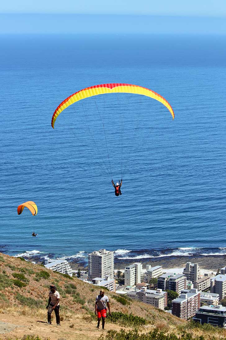 Paragliding Signal Hill Cape Town - one of the best things to do in Cape Town. You get a beautiful view Signal Hill, Lions Head, Table Mountain, and the ocean // localadventurer.com