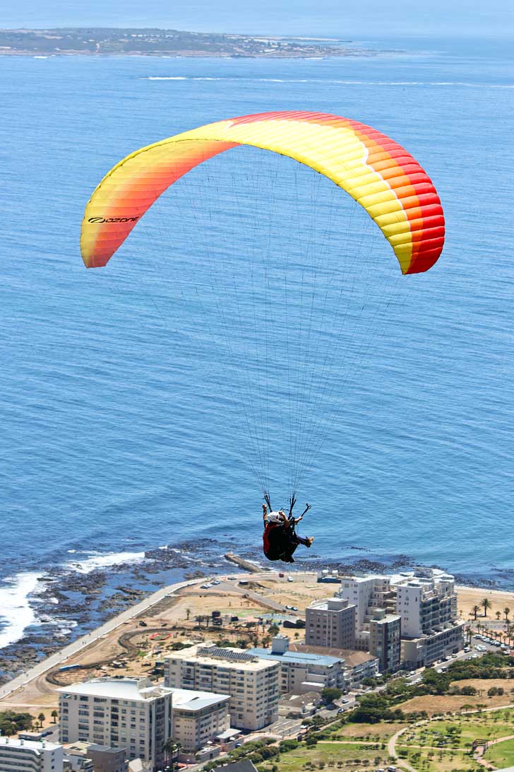 Paragliding Signal Hill Cape Town - one of the best things to do in Cape Town. You get a beautiful view Signal Hill, Lions Head, Table Mountain, and the ocean // localadventurer.com