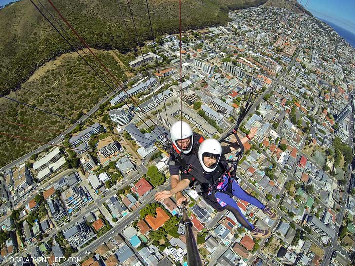 Paragliding Cape Town Signal Hill - one of the best things to do in Cape Town. You get a beautiful view Signal Hill, Lions Head, Table Mountain, and the ocean // localadventurer.com