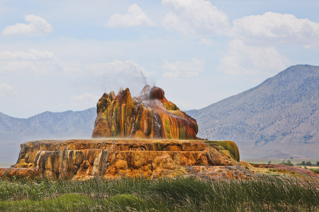 Did you know you can visit the Fly Geyser in the Nevada Desert? Check out this pin and save it to learn how to book the fly geyser tour. This natural wonder was on a private property, but the new owners are leading nature walks. Includes the best time to visit Fly Ranch, what to pack, and how to best take photos of this Nevada geyser and natural wonder. // Local Adventurer #localadventurer #travelnevada #dfmi #nevada #flygeyser #blackrockdesert #desert