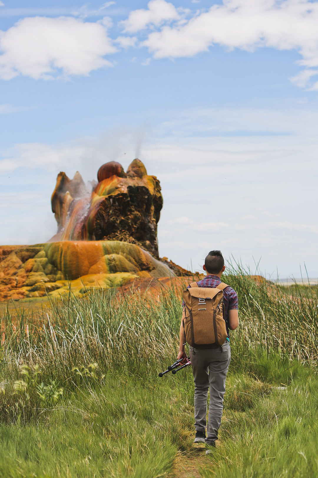 Fly Geyser is one of the top places to visit in Nevada. Save this pin and click through to find out how to book a rare tour of this beautiful phenomenon. Up until recently, no one was allowed to visit the fly ranch geyser property, but now that Burning Man owns it, you can go on nature walk tours to learn more the beautiful black rock desert, fly geyser tour, art installations, and the hot springs. // Local Adventurer #travelnevada #dfmi #nevada #flygeyser #blackrockdesert #desert