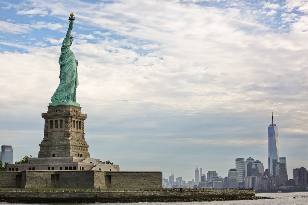 Statue of Liberty National Monument + Did you know that there are 11 national parks in New York City? Save this pin and click through to see our ultimate guide. We include tips on visiting the Statue of Liberty National Monument, Federal Hall, and other famous landmarks in New York. To keep you exploring, we even include a list of the upstate ny state parks, popular new york state parks, and other nyc parks. // Local Adventurer #seeyourcity #nycgo #nyc #iloveny #newyork #newyorkcity #visittheusa